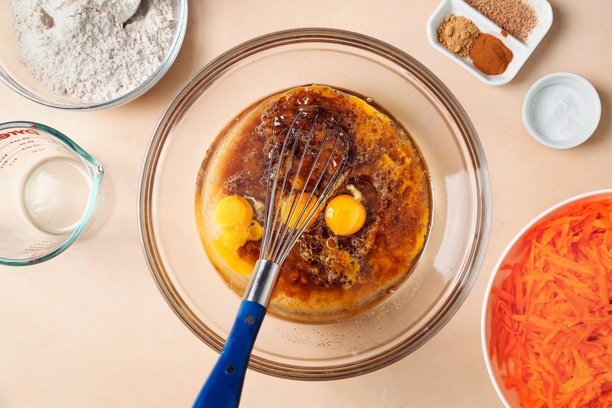 Carrot cake batter mixed in a large bowl.
