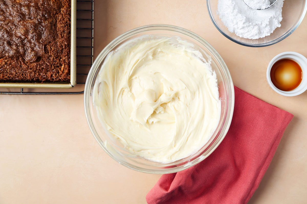 Cream cheese frosting whipped in a large mixing bowl.