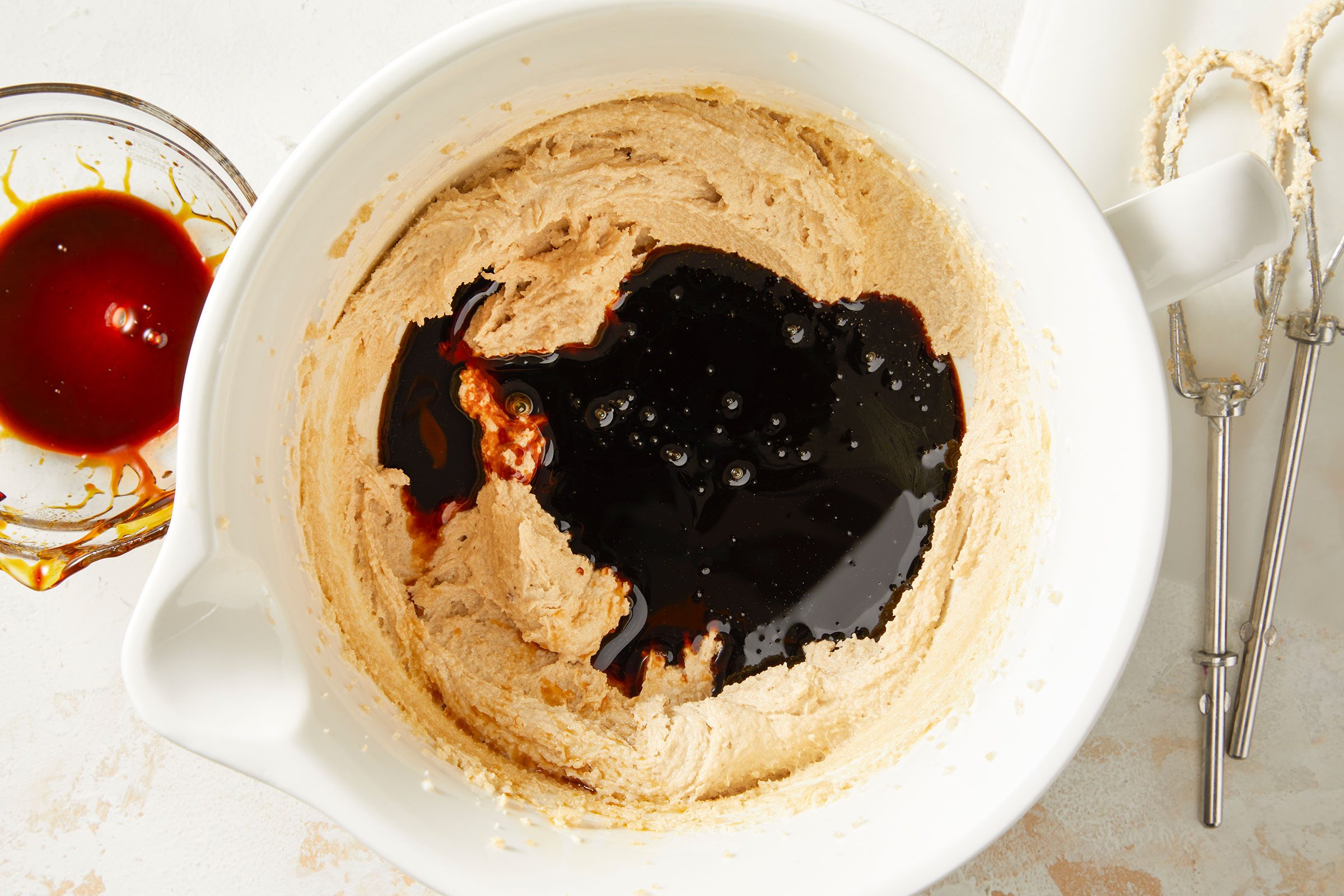 Creamed butter and brown sugar beaten with the molasses and vanilla extract in a large bowl