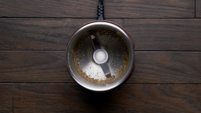 Place cardamom pod in a spice grinder and grind into a powder