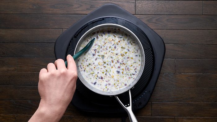 Stir in nuts and raisins and if desired rose water and cook until raisins are plump