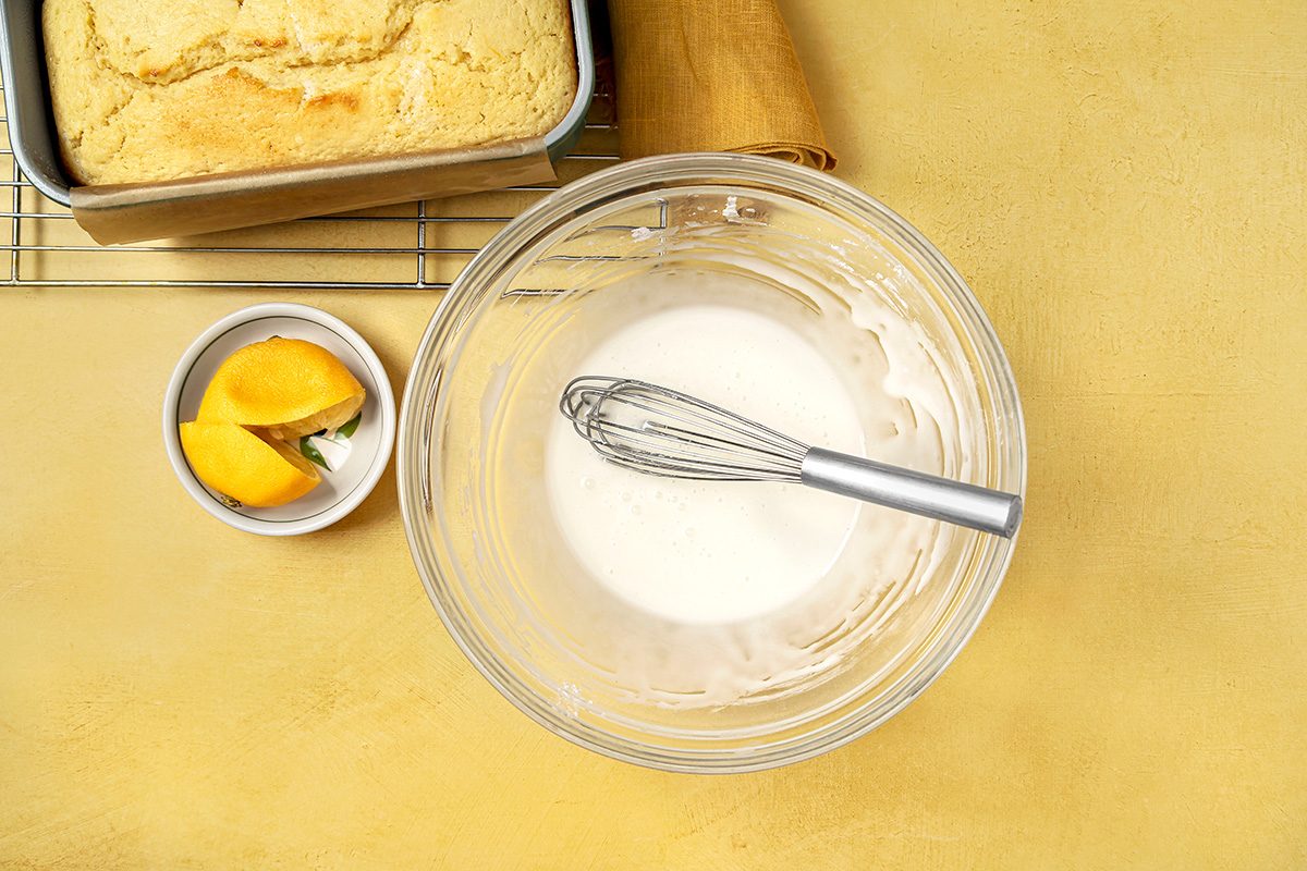 Lemon drizzle mixed in large mixing bowl