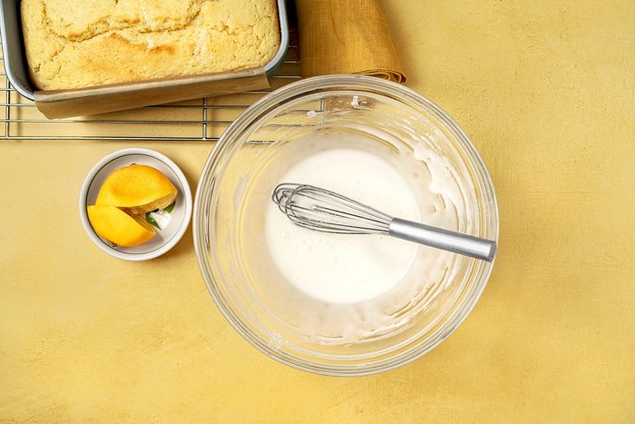 Lemon drizzle mixed in large mixing bowl