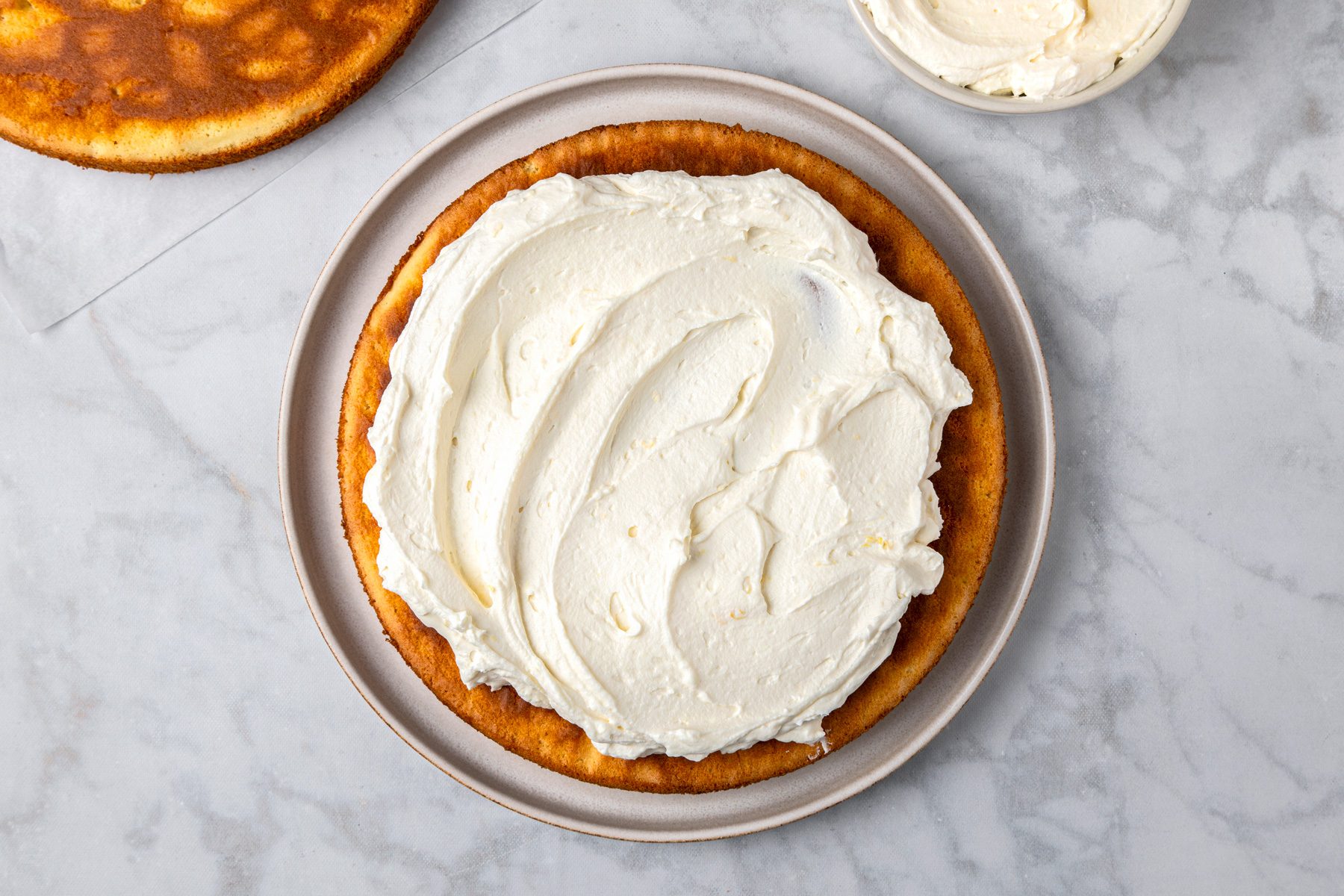 Spread the frosting on top of the cake