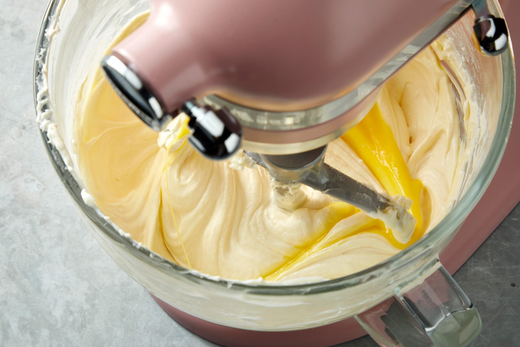 Close shot of beat on low speed just until combined; on a grey surface;