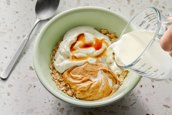 Milk, peanut butter, yogurt and vanilla added to the oatmeal mixture