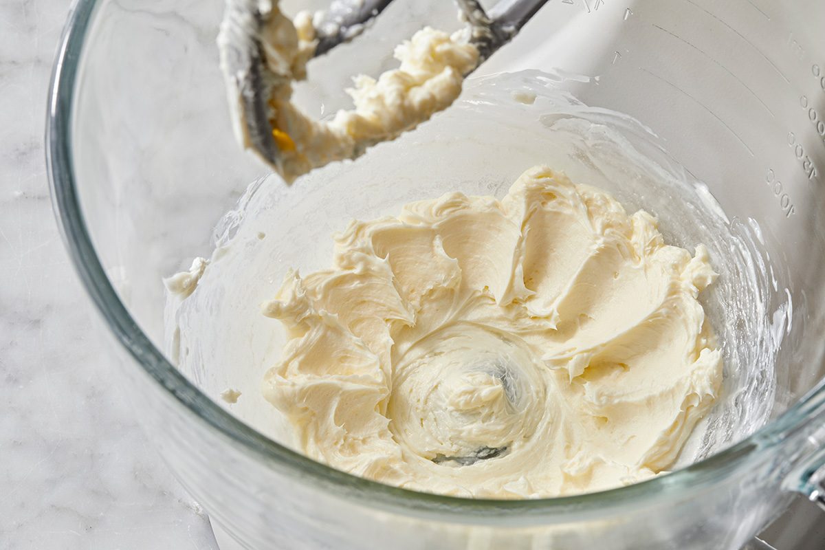 Close up shot; For frosting, in a small bowl beat cream cheese and butter until fluffy