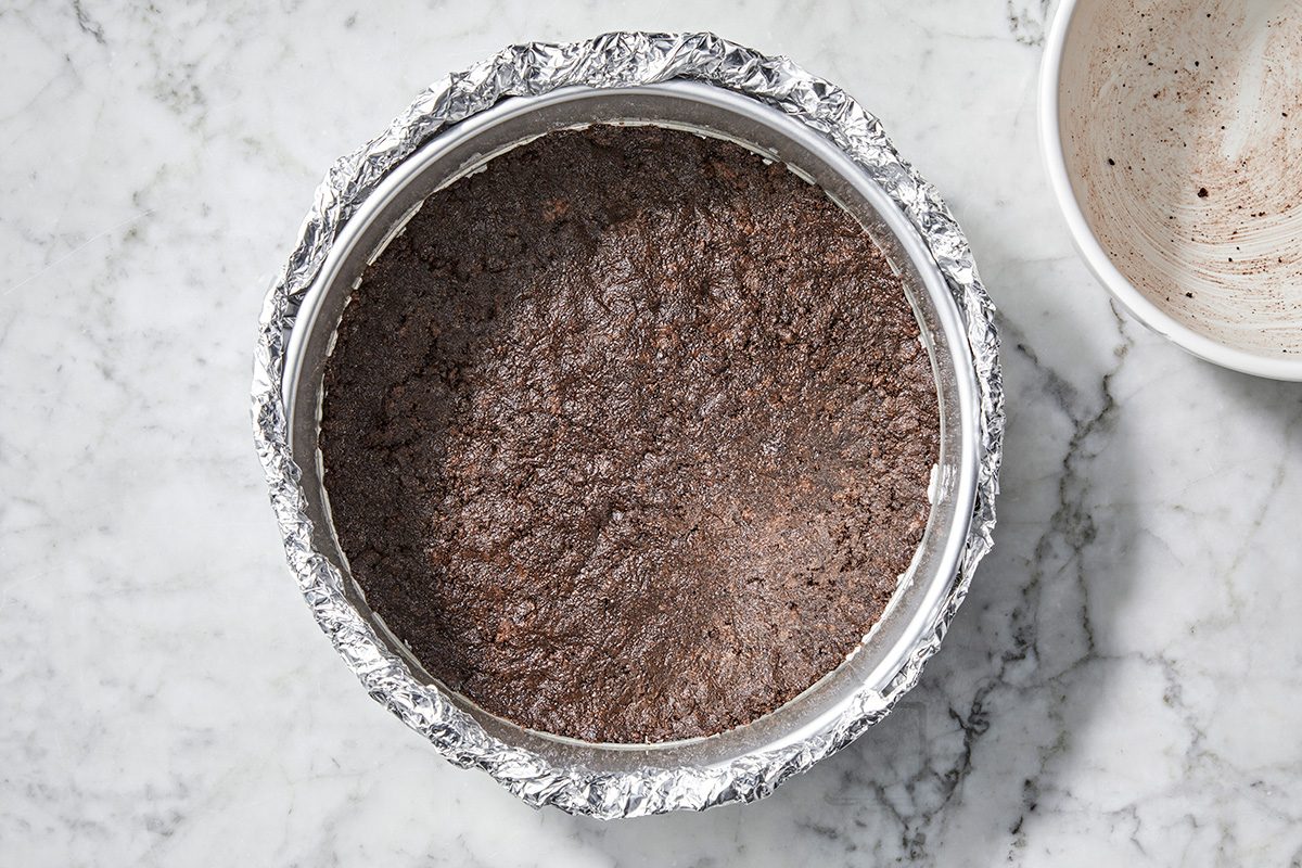 Overhead shot; In a small bowl combine the cookie crumbs, butter and sugar