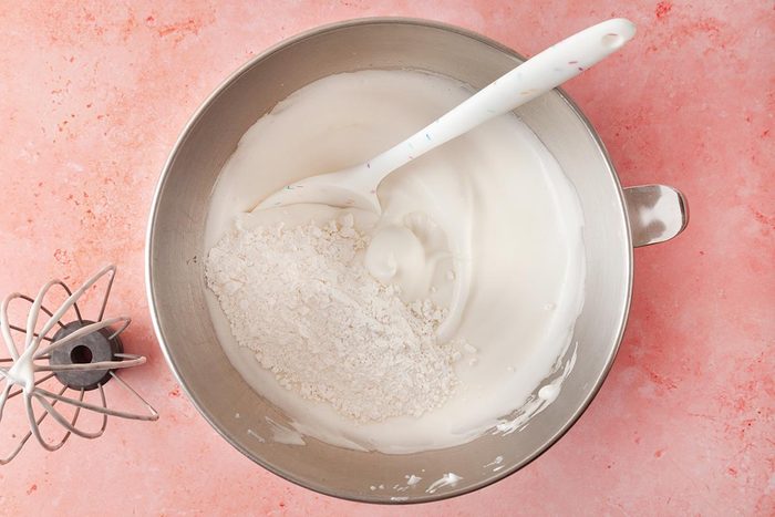 mixing bowl filled with whipped cream or a cream based batter