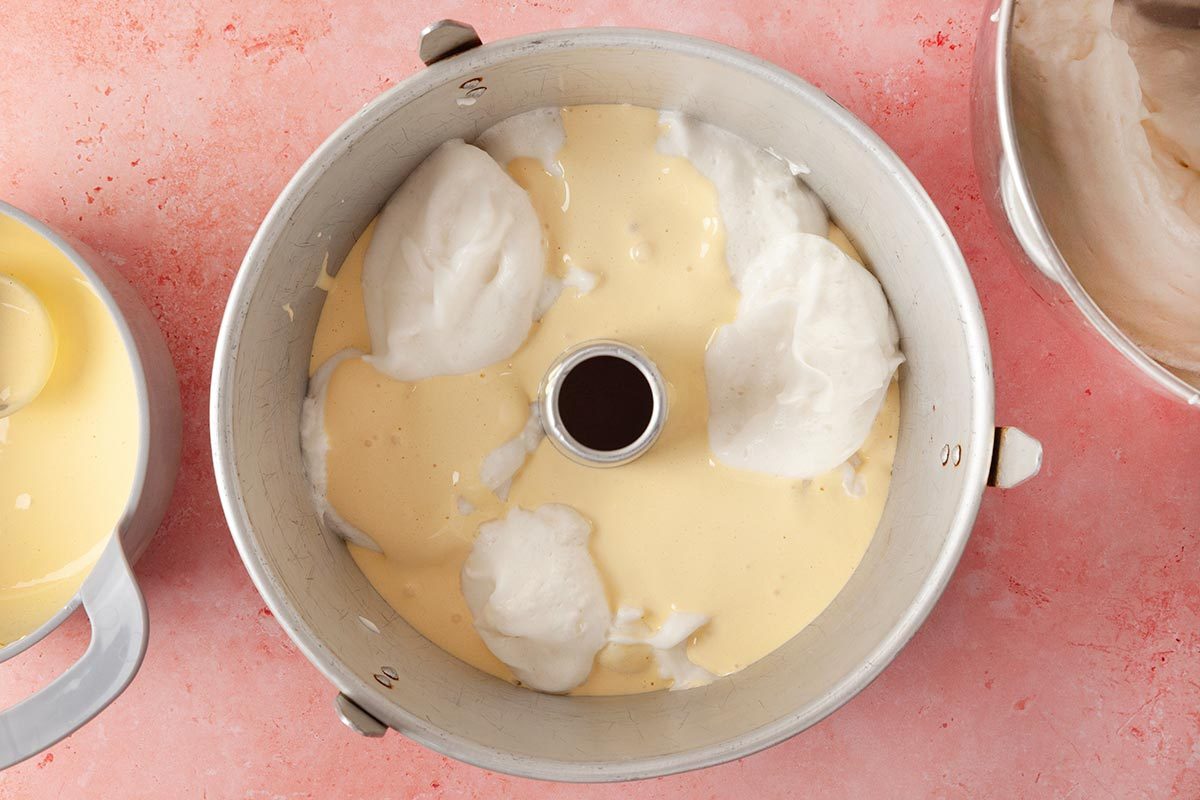 mixing bowl filled with a pale yellow batter