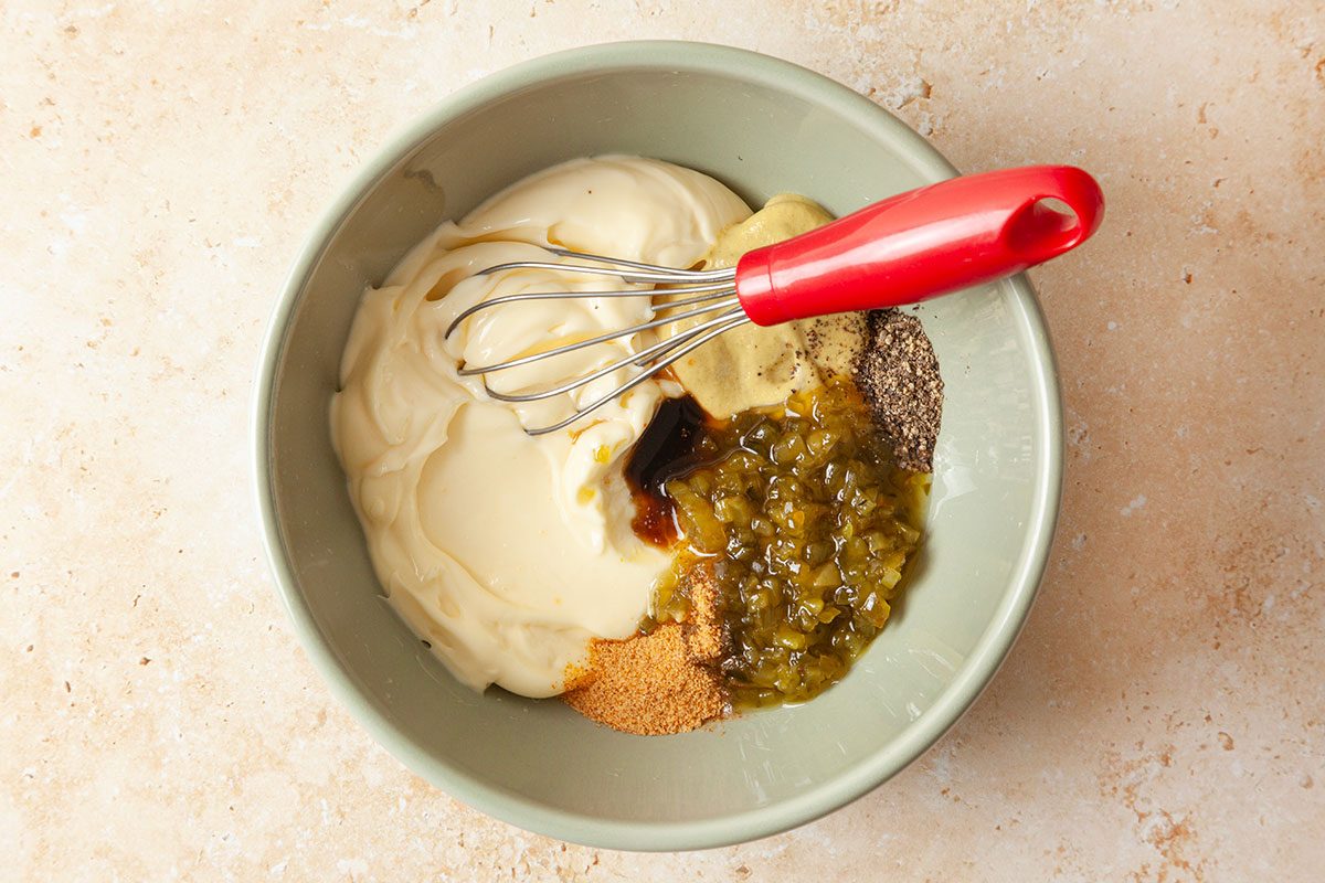 Mayonnaise, relish, Dijon mustard, seasoned salt, black pepper and Worcestershire sauce in a small bowl