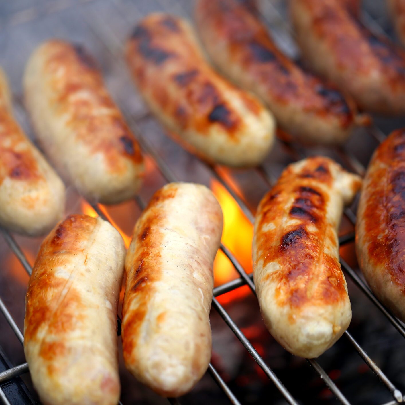 Nicely grilled sausages on a whole background