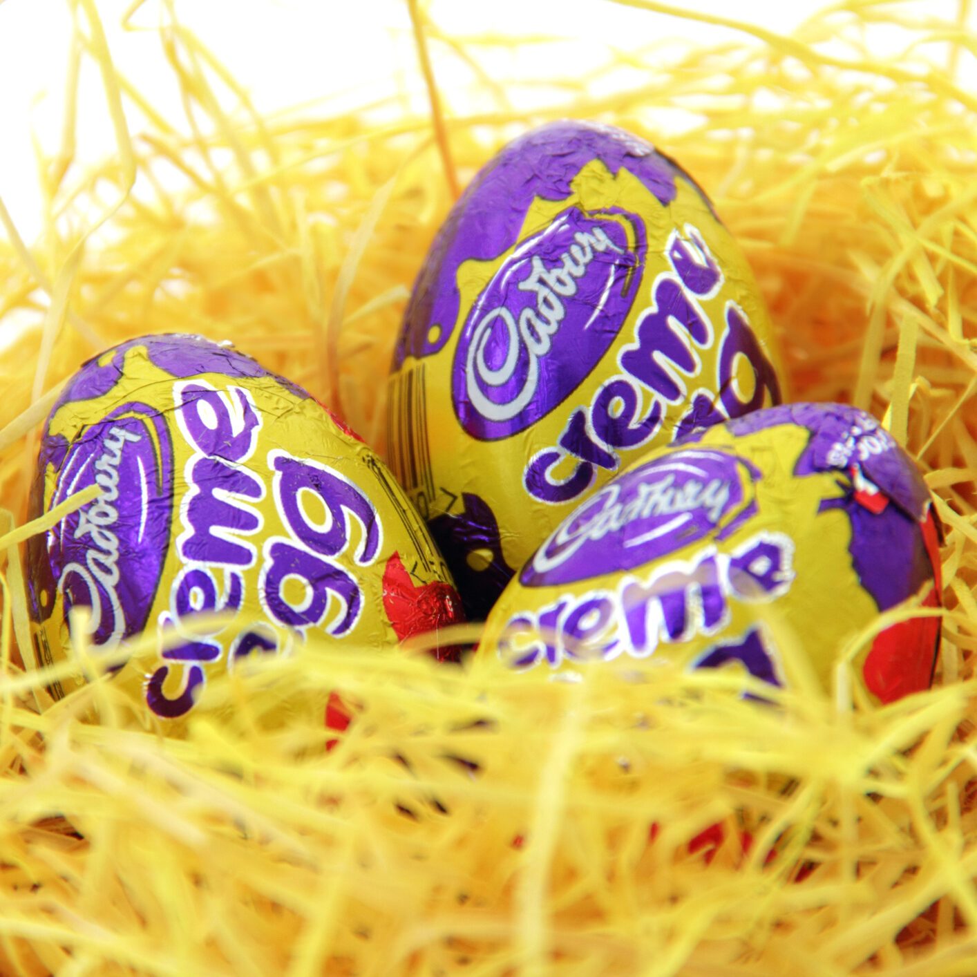 cadbury eggs in yellow straw