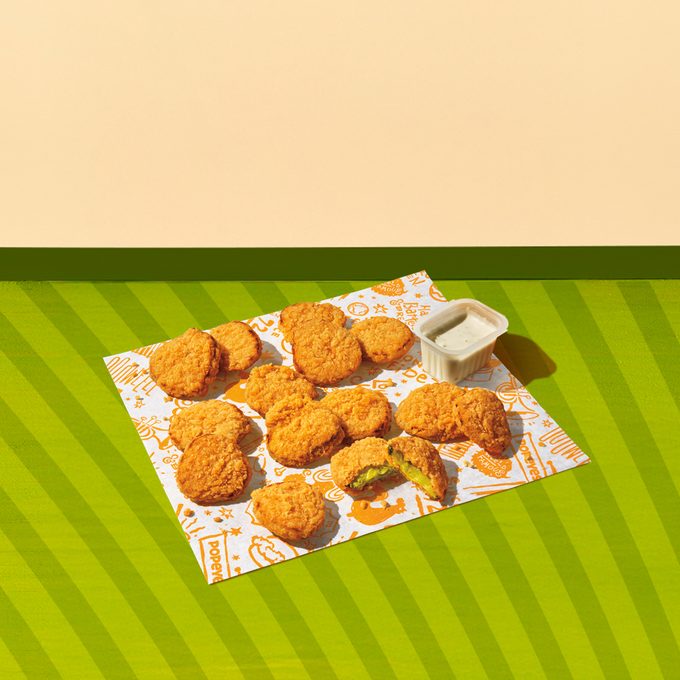 Popeyes Fried Pickles on a green background