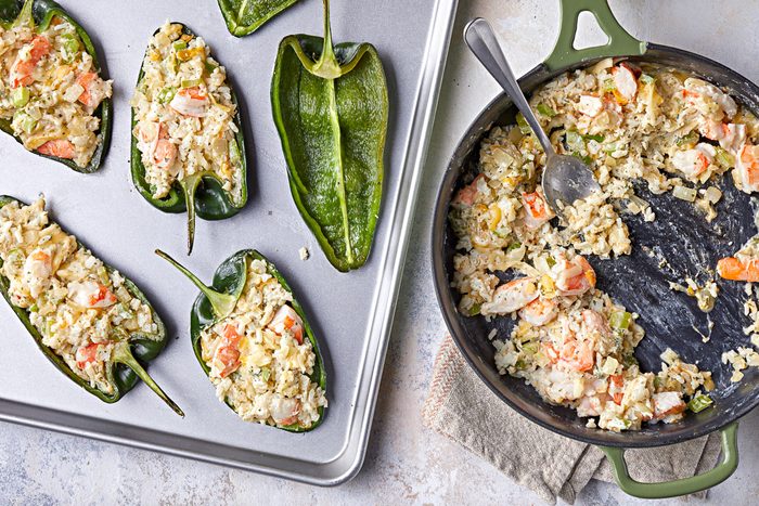 peppers stuffed with hot filling with skillet next to them