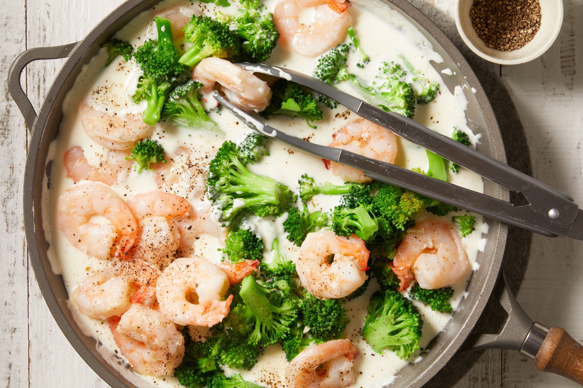 Stir the broccoli, shrimp, salt and pepper into cheese sauce; heat through.