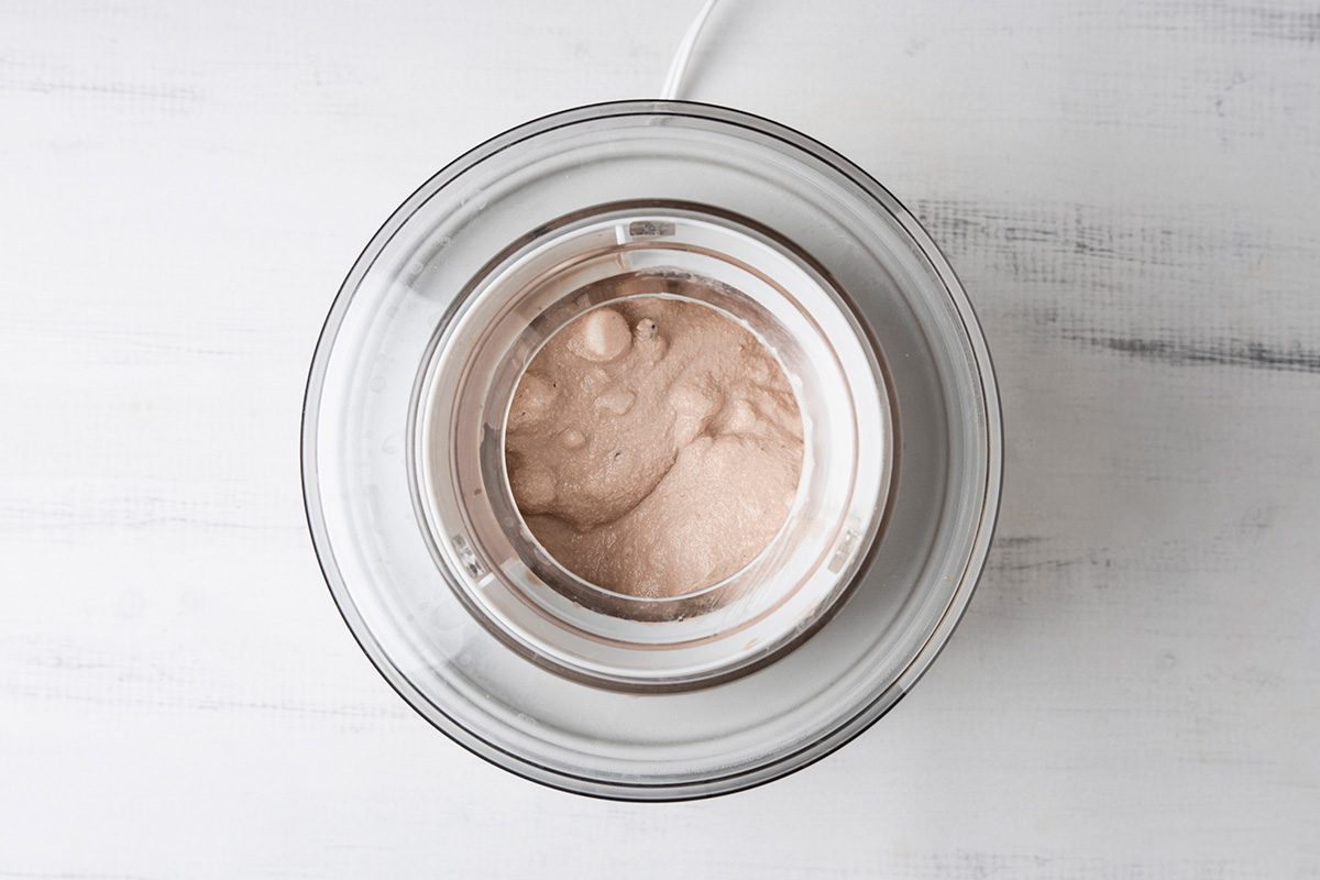 Overhead shot of fill cylinder of ice cream maker two-thirds full; freeze according to the manufacturer’s directions