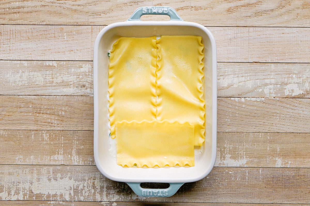 bottom of baking dish covered with two noodle pieces