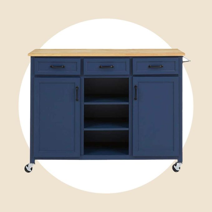 Home Depot blue kitchen island on wheels with butcher block on top, on a tan and white background