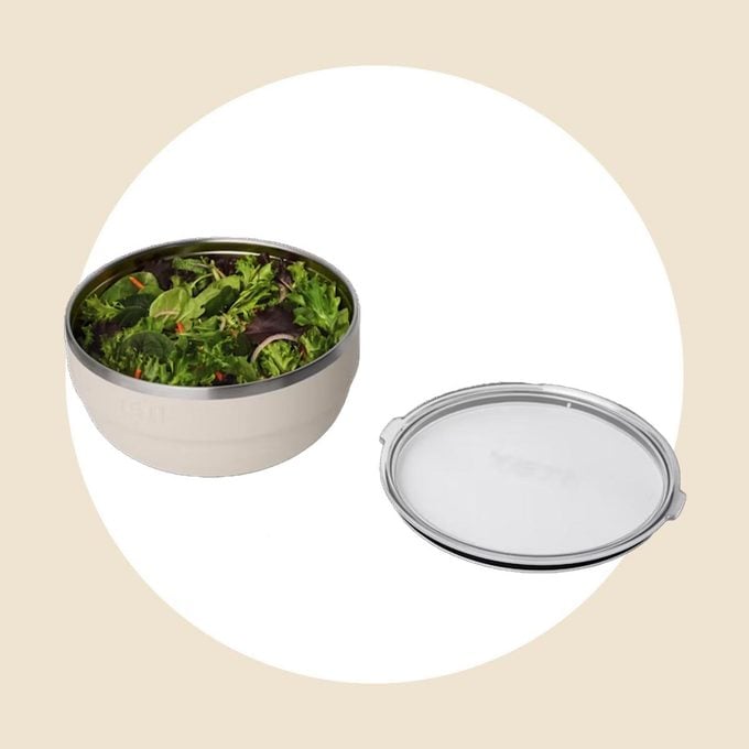 Yeti bowl full of salad with lid next to it