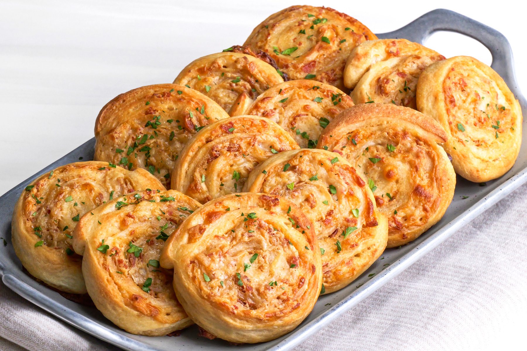 Baked Pinwheels is ready and served in a tray