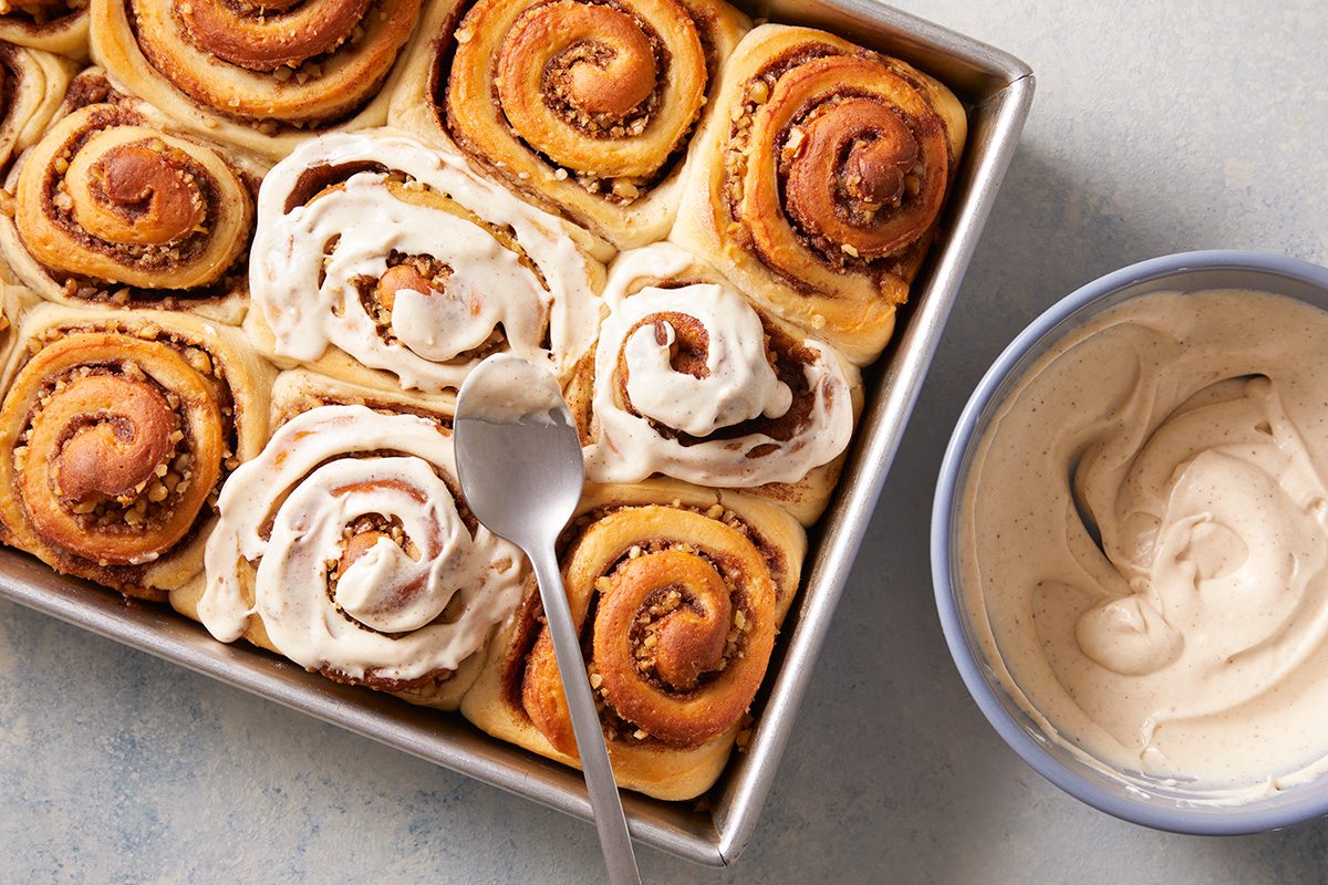 Spread frosting over tops