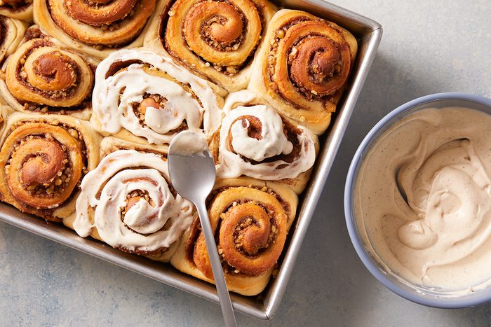 Spread frosting over tops