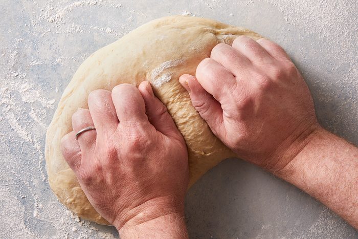 Turn out dough onto a floured surface; knead until smooth and elastic