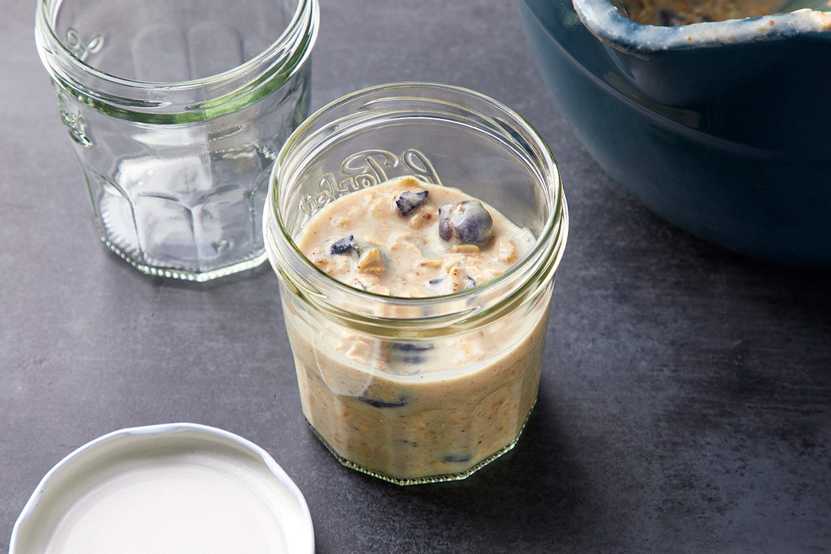 Overhead shot of divide into containers; cover; refrigerate overnight; all set on a dark surface;