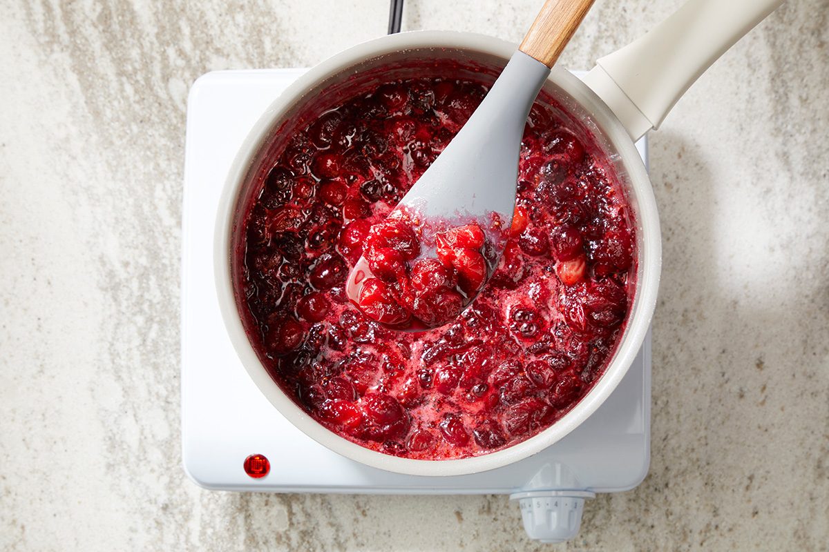 in a large saucepan; combine cranberries; sugar and water. Cook; uncovered