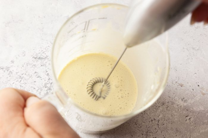 To the remaining pistachio and tahini mixture add heavy cream 1 tablespoon at a time; whisking after each addition until smooth