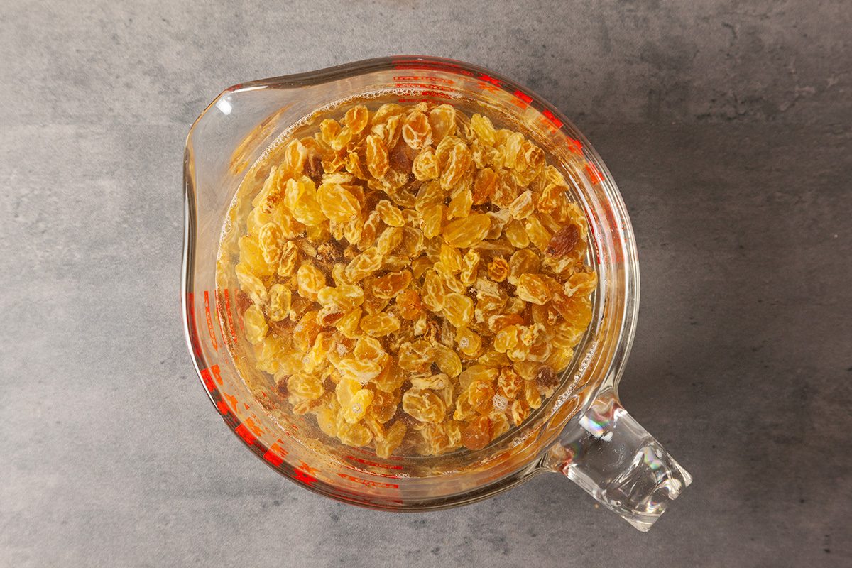 Place raisins in a small bowl; cover with cold water.