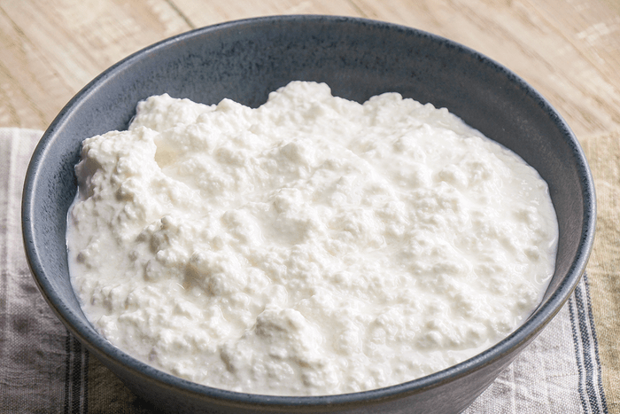 Homemade Ricotta Cheese is ready and served in a Bowl