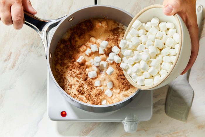 overhead shot of a small saucepan; combine the first four ingredients; induction; spatula; marble surface