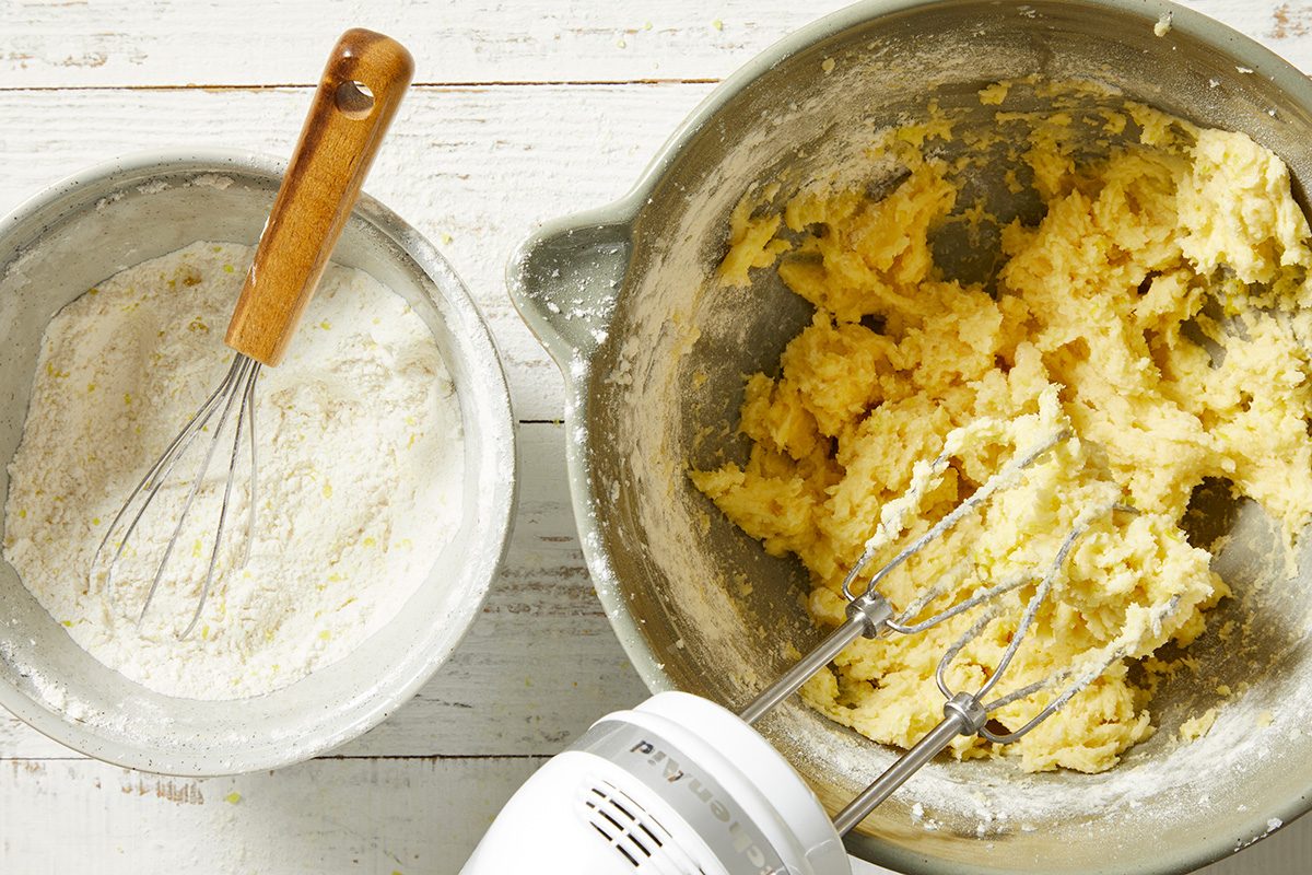Combine the flour, baking powder and salt; gradually add to the creamed mixture and mix well.
