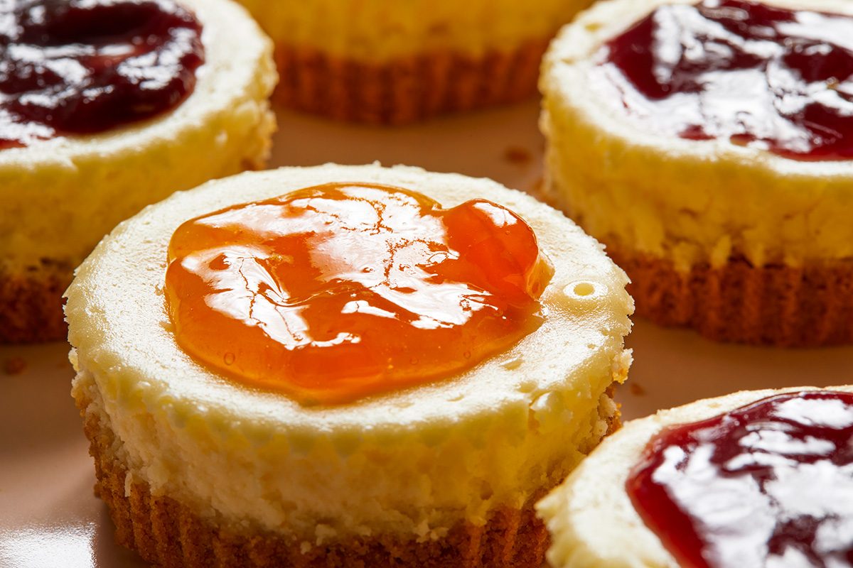 Close-up view shot of Jam-Topped Mini Cheesecakes; served them on a big serving plate