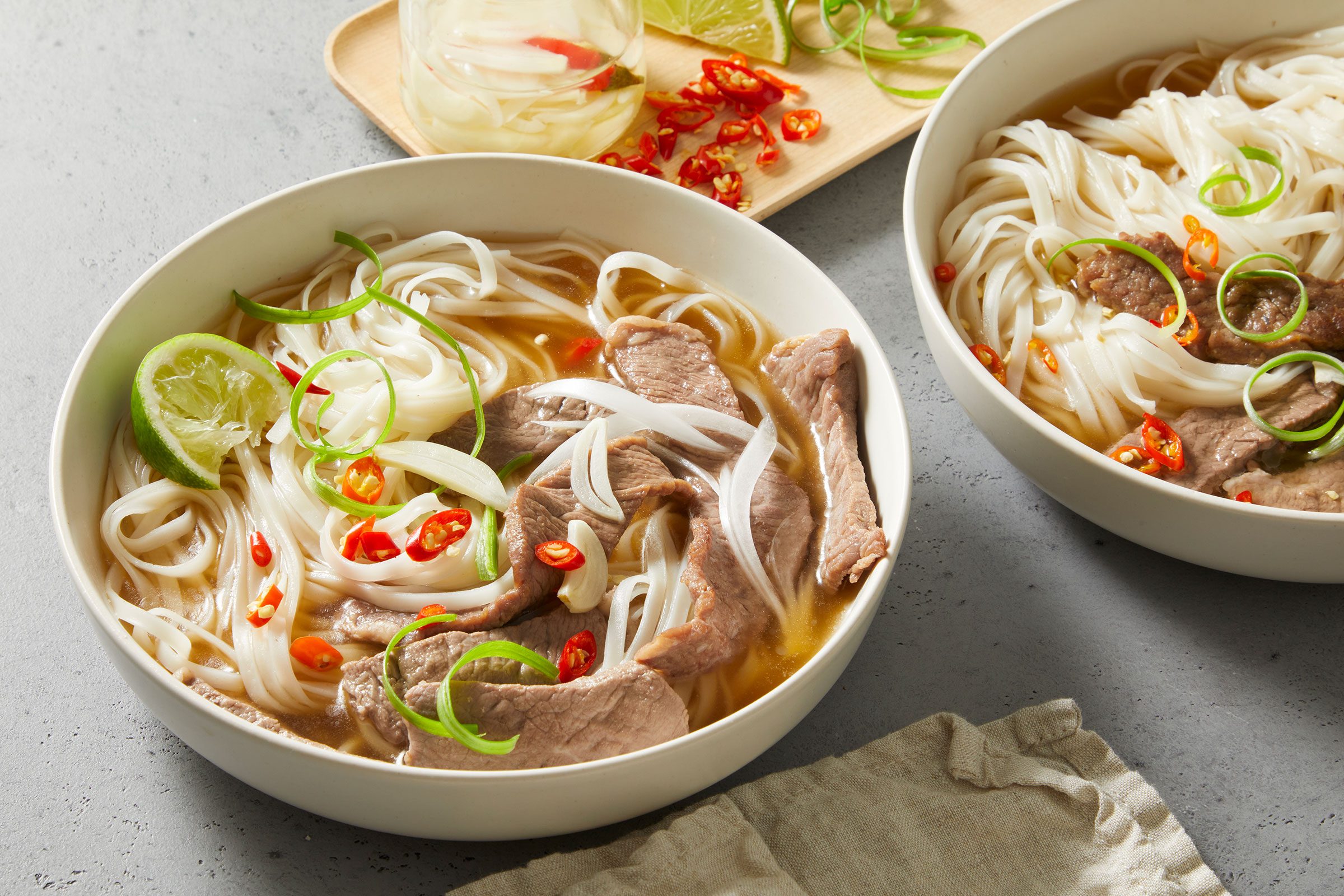 Pho (vietnamese Noodle Soup) in big white bowls