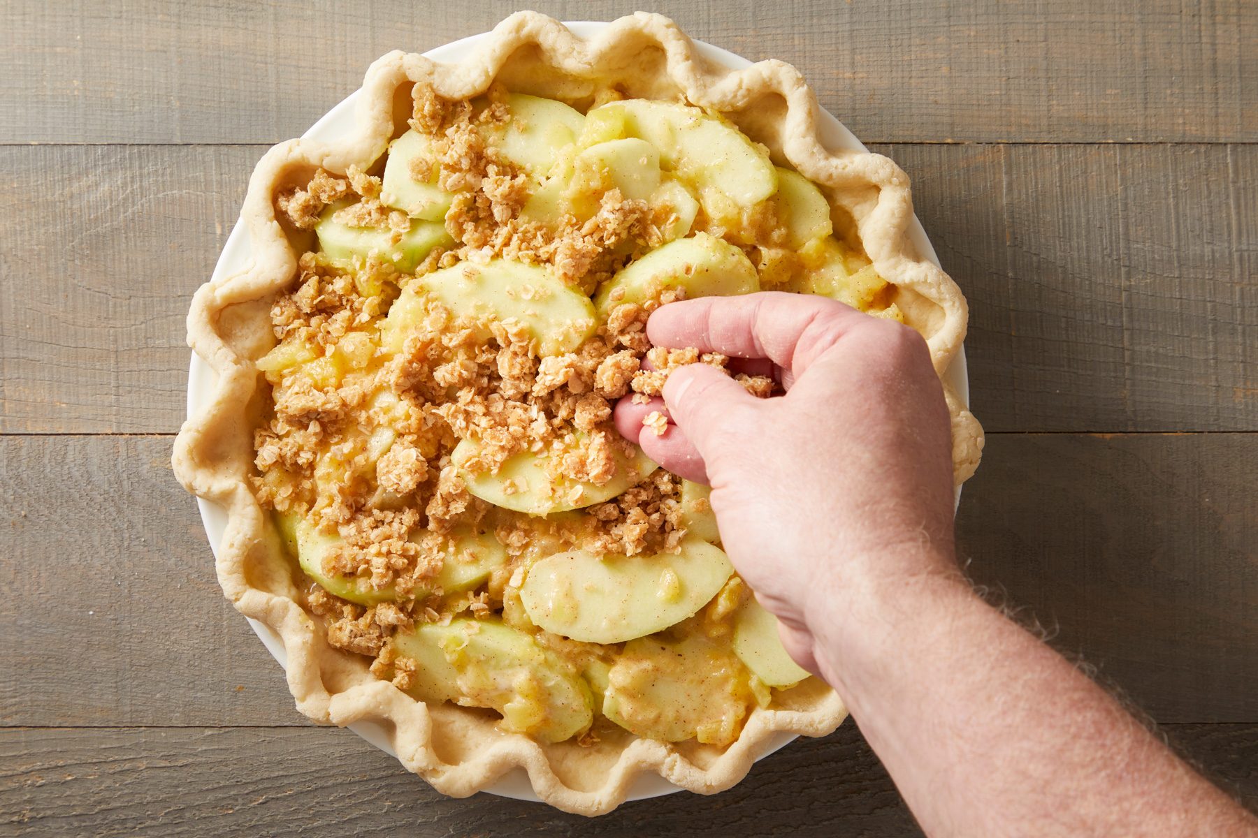 sprinkle oats, brown sugar, flour and butter mixture over filling.