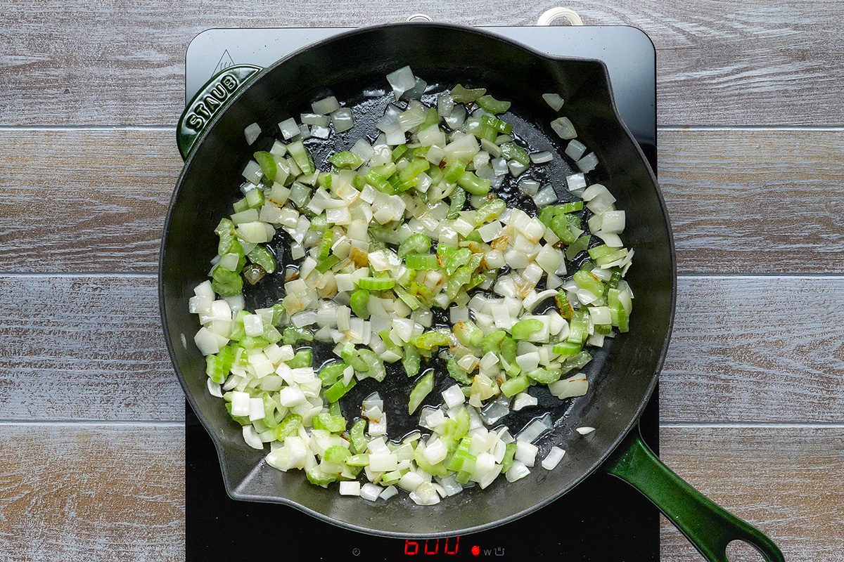 In a large skillet heat butter and cook celery and onion