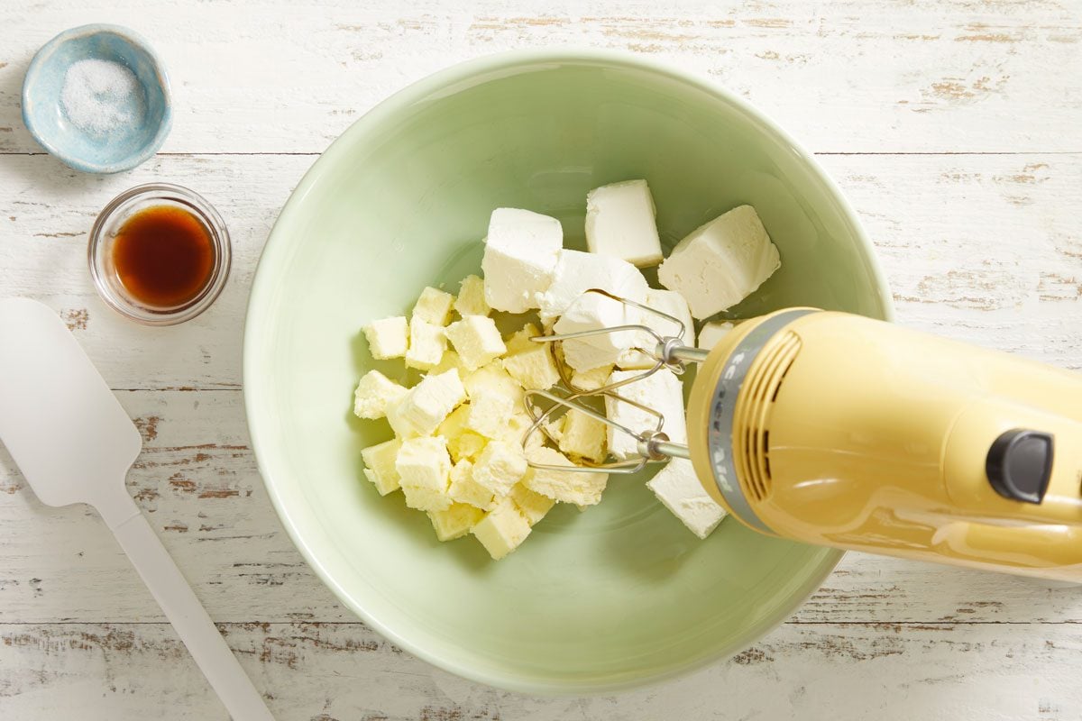 In a large bowl, beat cream cheese, butter, vanilla and salt