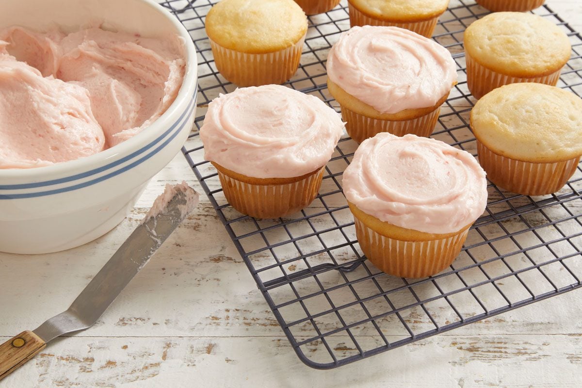 3/4 shot of Strawberry Cream Cheese Frosting on cupcakes