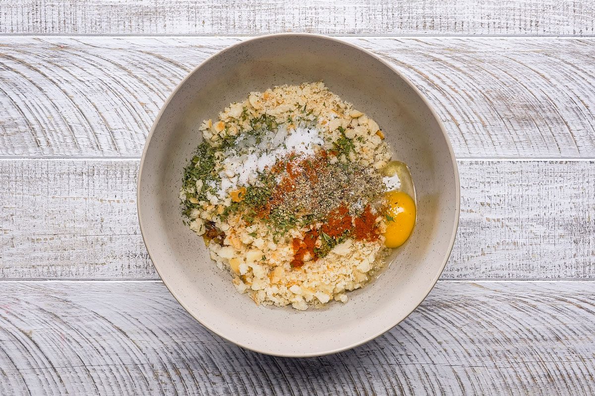 Combine the bread crumbs; egg; water; parsley; salt; marjoram; paprika and pepper in a small bowl