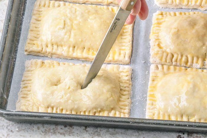 cutting slits in the tops using a paring knife