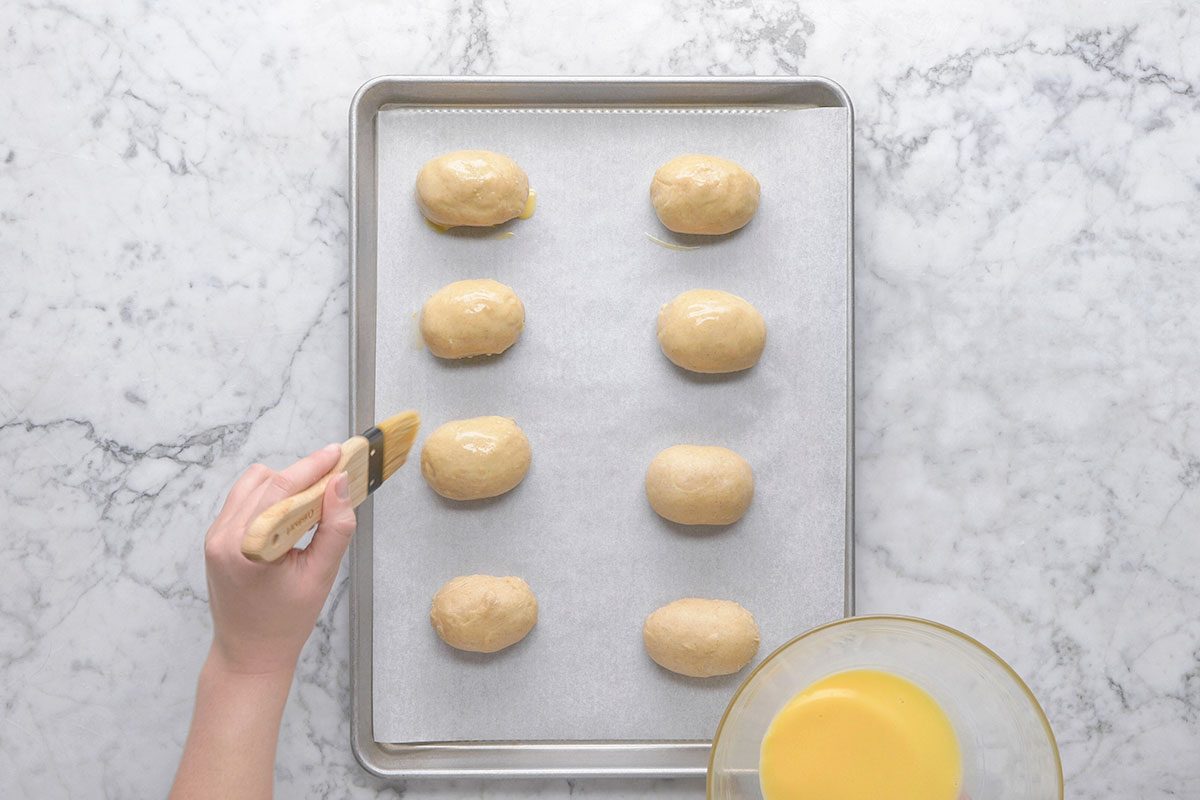 Dough placed on parchment paper in a tray