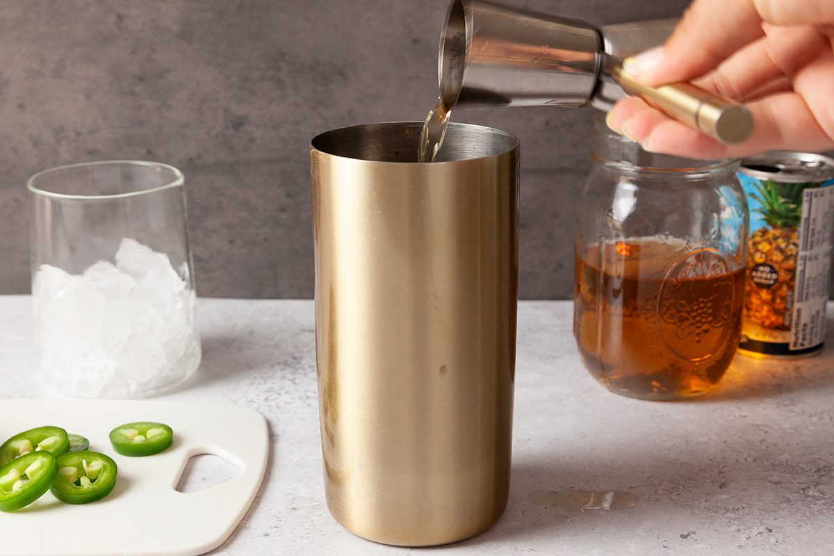 fill a rocks glass with crushed ice. Fill a cocktail shaker with ice cubes. Add 1-1/2 ounces infused whiskey to the cocktail shaker