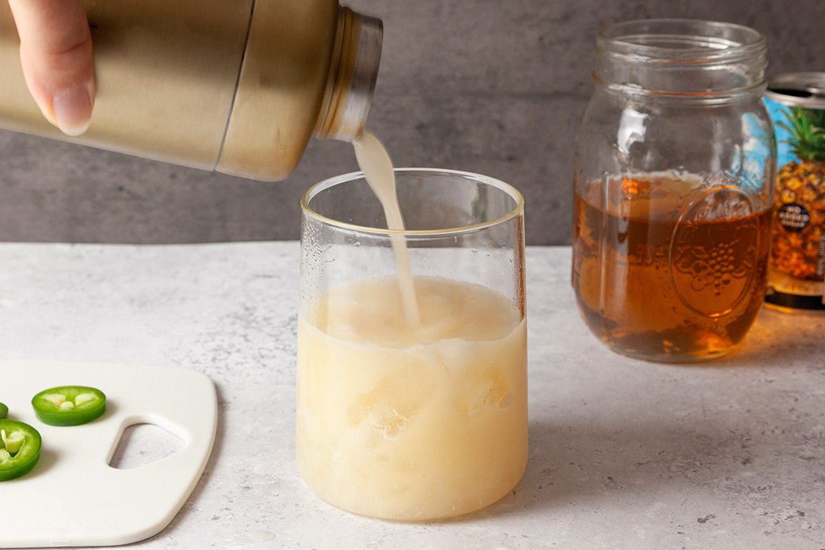 Strain into the prepared glass