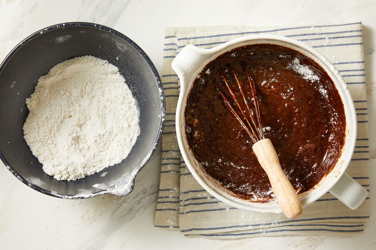flour, baking soda and salt mixture being added to chocolate mixture