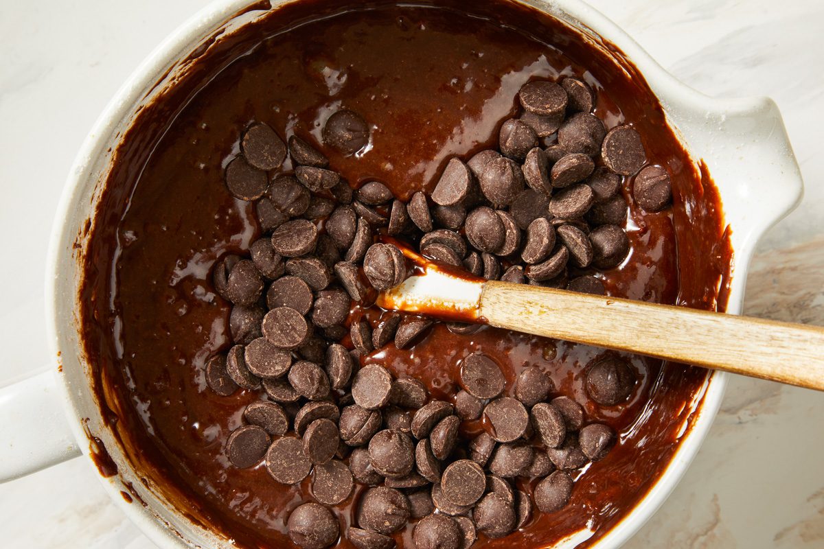 chocolate chips being added to brownie batter
