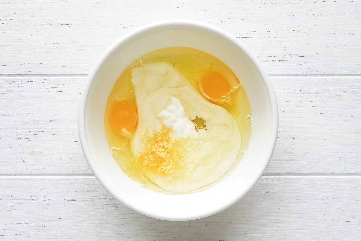 eggs, yogurt, oil and lemon zest in a bowl