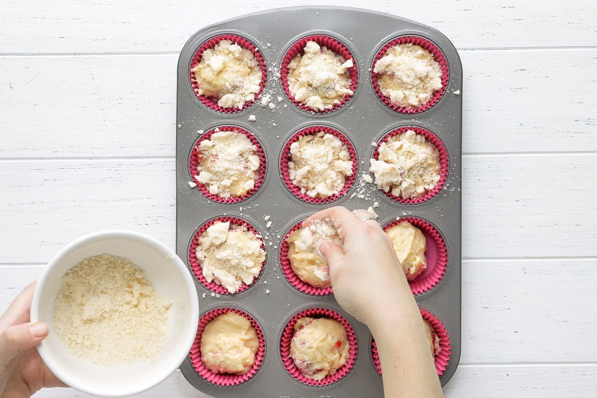 topping being sprinkled over batter